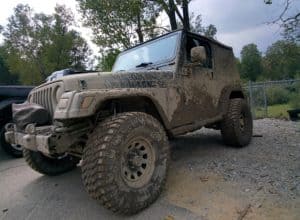 Mud-covered Jeep Wrangler
