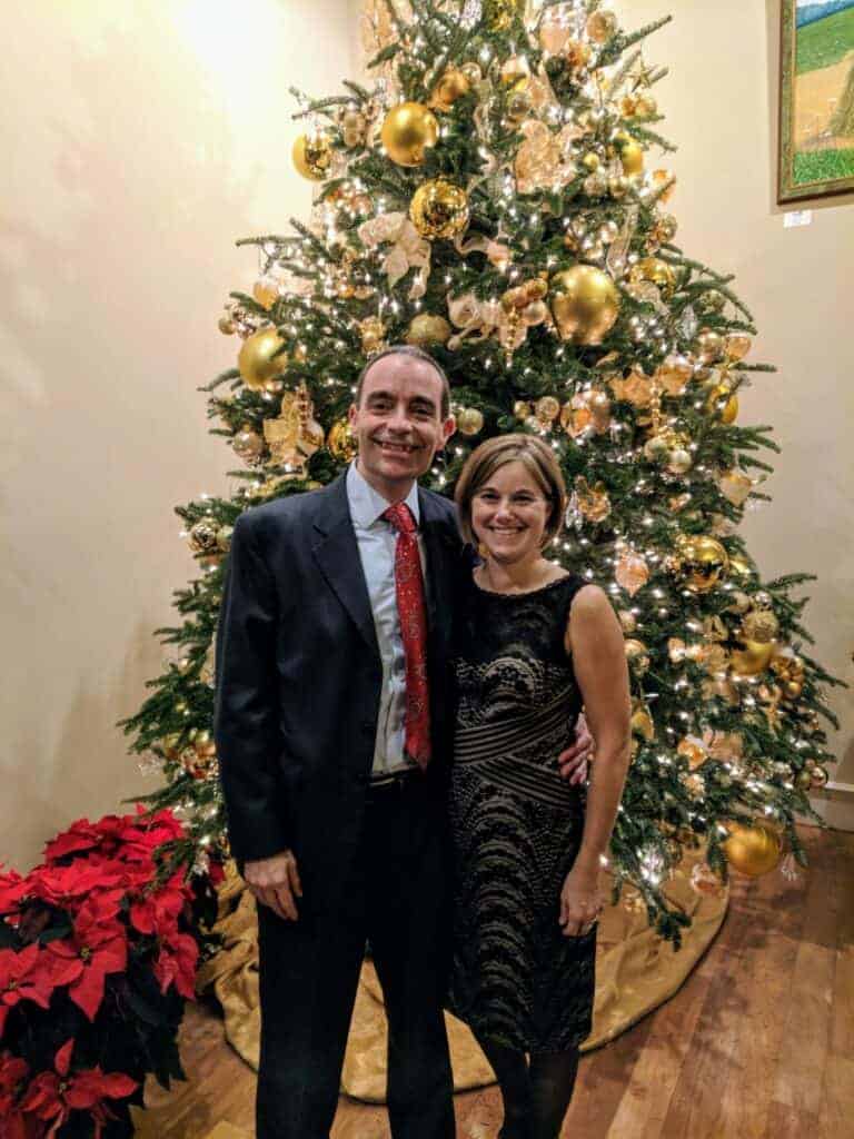 Man and woman in front of Christmas tree