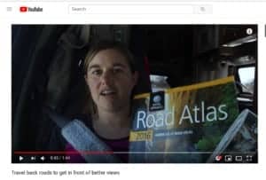 Woman holding atlas