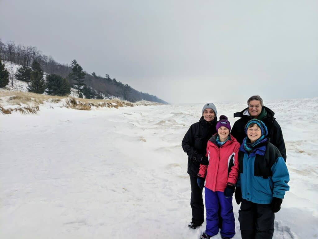 Family on Michigan beach in winter