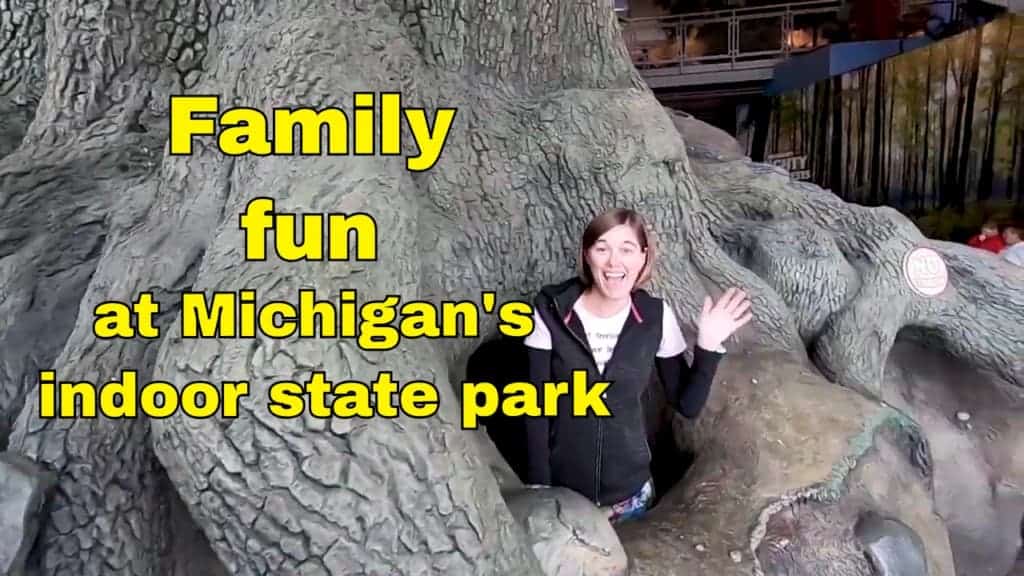 Woman in fake tree at Outdoor Adventure Center 