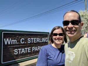 woman and man at state park sign