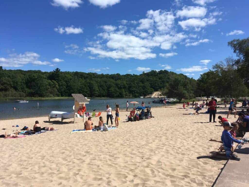 People on a beach at Hamlin Lake