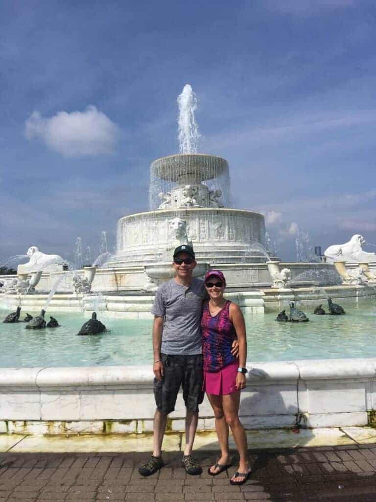Two adults in front of fountain on Belle Isle